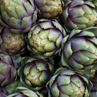 Close-up of a bunch of artichokes with green and purple hues. Fluxa Lipid Flow.
