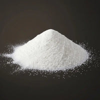 Pile of white powder on a black background.  Fluxa Lipid Flow.